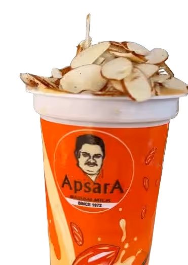 Close-up of Apsara Badam Milk served hot with almond slices on top