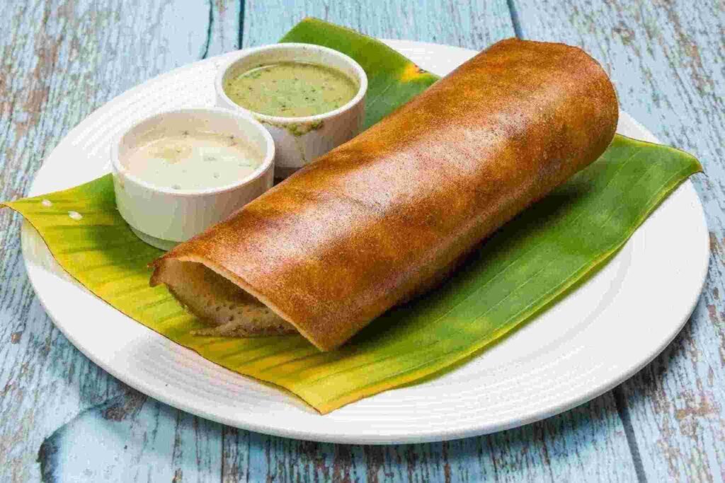 CTR Benne Masala Dosa served on banana leaf with coconut chutney and sagu in Bangalore