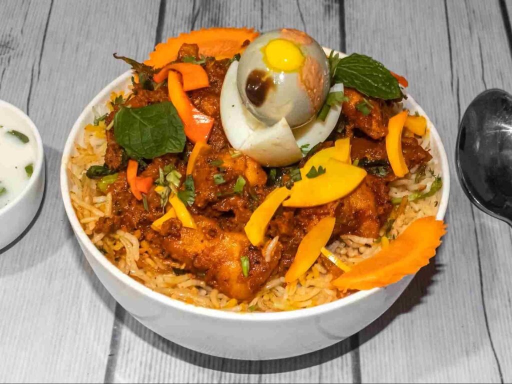 Spicy chicken biryani with boiled egg served at Hotel Rajadhani Rayachoty
