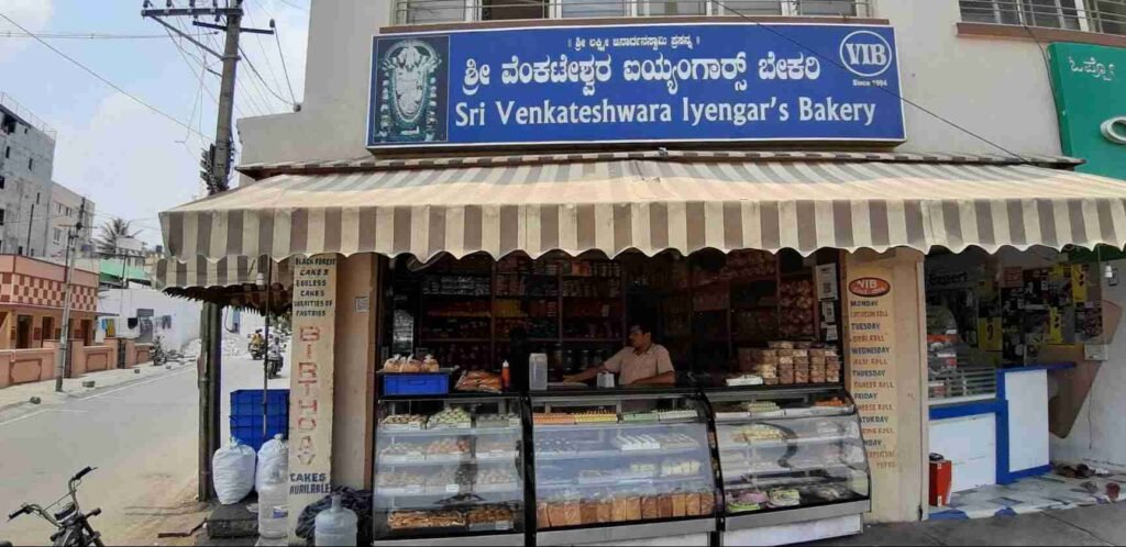 Sri Venkateshwara Iyengar's Bakery storefront in Krishnarajapuram, Bengaluru displaying traditional Iyengar bakery snacks and glass counters
