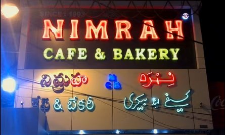 Nimrah Cafe and Bakery neon signboard near Charminar Hyderabad