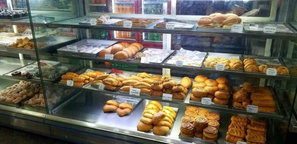 Fresh donuts, pastries, sandwiches and buns displayed at Thom’s Bakery Bengaluru