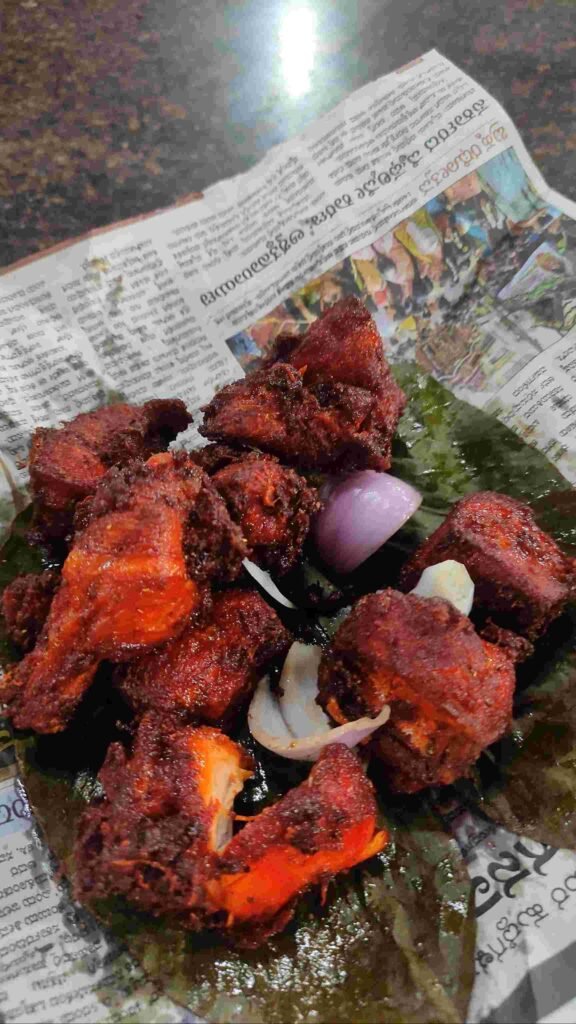 Close up of spicy chicken kabab served on banana leaf at Ravi Kabab Centre