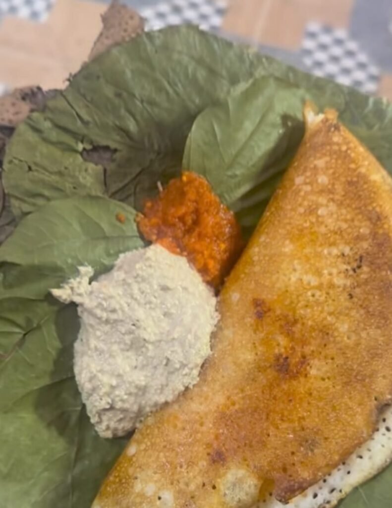 Crispy ghee masala dosa served on banana leaf with chutney and karam at Anuradha Hotel Kadiri