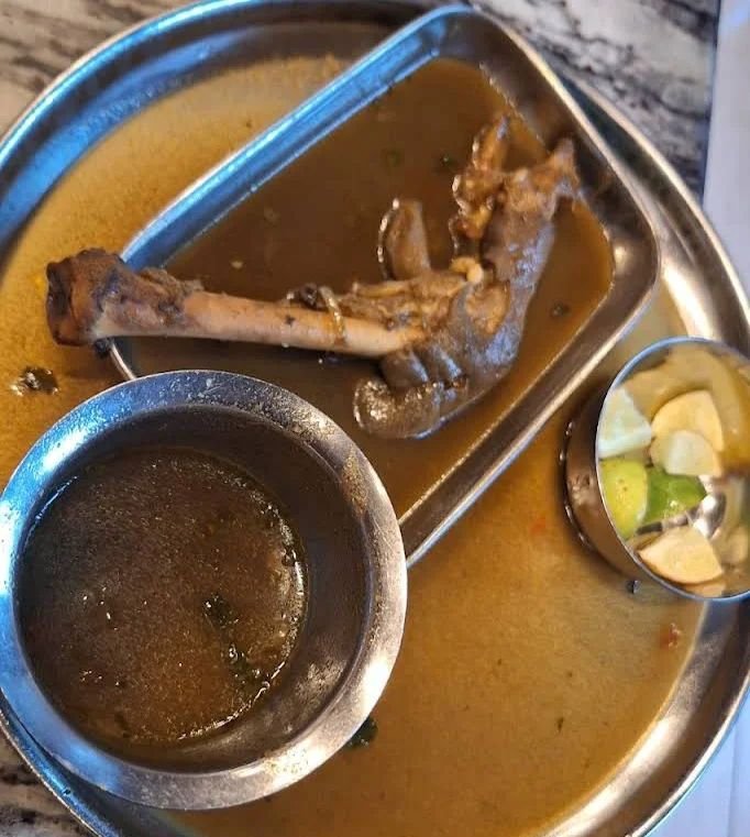 Kaal soup with mutton trotter served at Hotel Aditya Mahalaxmipuram Bangalore