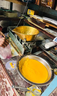 Freshly prepared Kollegala Badam Halwa being packed at the traditional 150-year-old sweet shop in Kollegala, Karnataka.