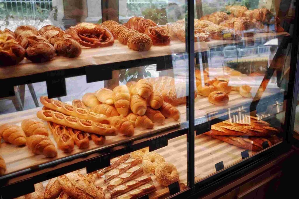 Fresh pastries, croissants, and baked goods displayed inside Wenger’s bakery counter in Connaught Place, Delhi.