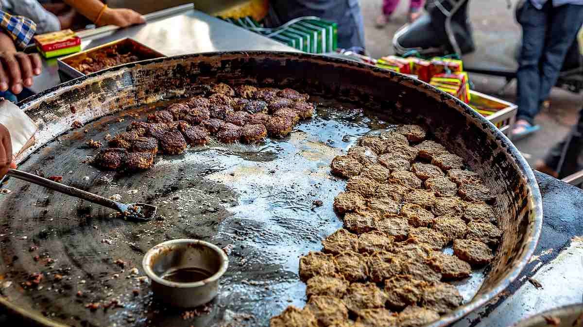 Galouti kebabs cooking on large tawa Lucknow street food Tunday Kababi