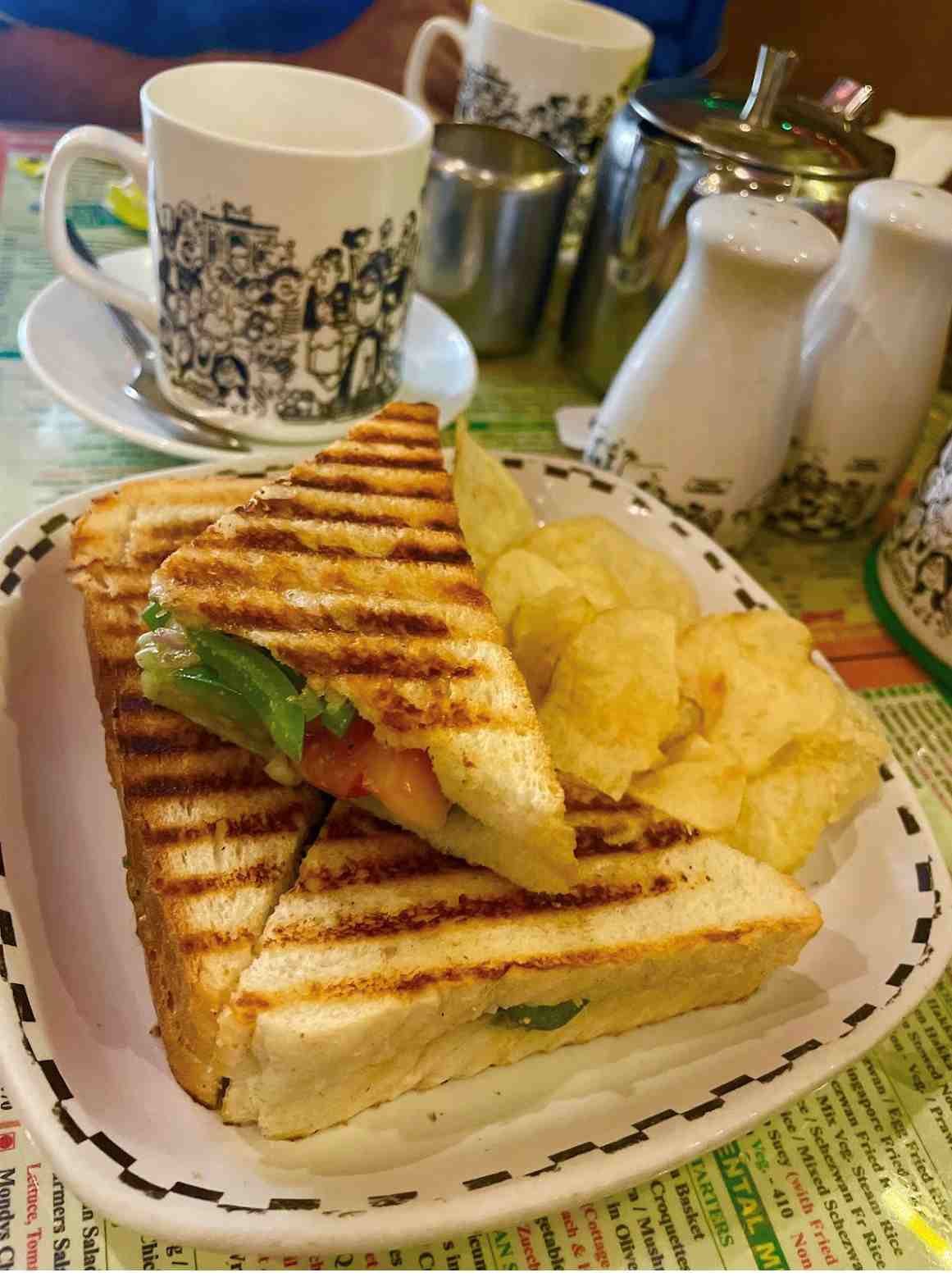 Grilled sandwich with coffee at Cafe Mondegar Mumbai popular food items