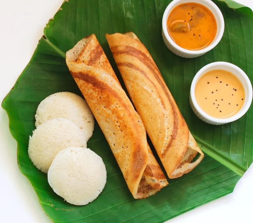 Crispy masala dosa with idli and chutney served on banana leaf at Airlines Hotel Bangalore