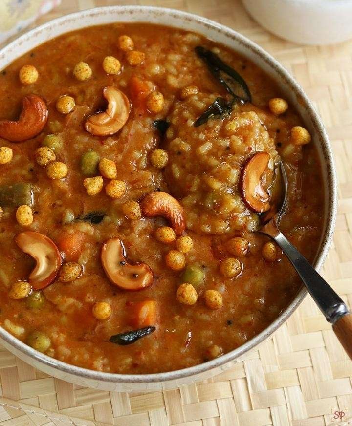 Authentic Bisi Bele Bath Karnataka style with rice, lentils, vegetables, cashews and boondi topping