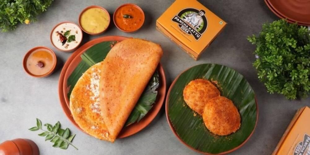 Pancha Kattu Dosa served with chutneys and podi on banana leaf in traditional Andhra style