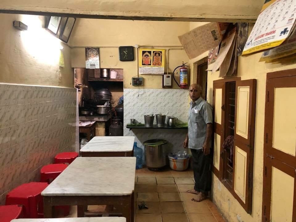 Inside Rayar’s Mess Mylapore small dining area with traditional kitchen setup Chennai