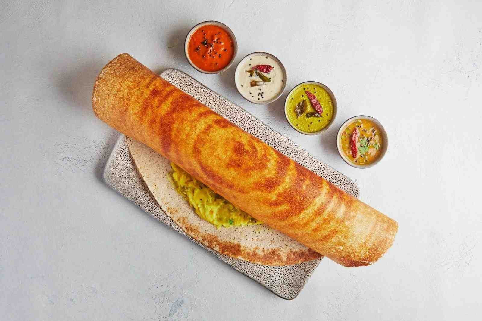 Crispy masala dosa at Saravana Bhavan Chennai served with chutneys and sambar