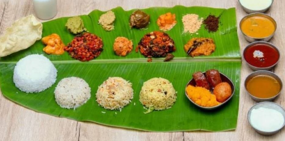 Traditional Andhra meals served on banana leaf at Subbayya Gari Hotel Kakinada with rice, curries, pickles, and ghee