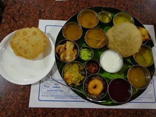 Saravana Bhavan tiffin combo with puri, vada, curries and chutneys