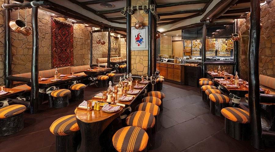 Bukhara restaurant interior at ITC Maurya Delhi with rustic decor and fine dining setup