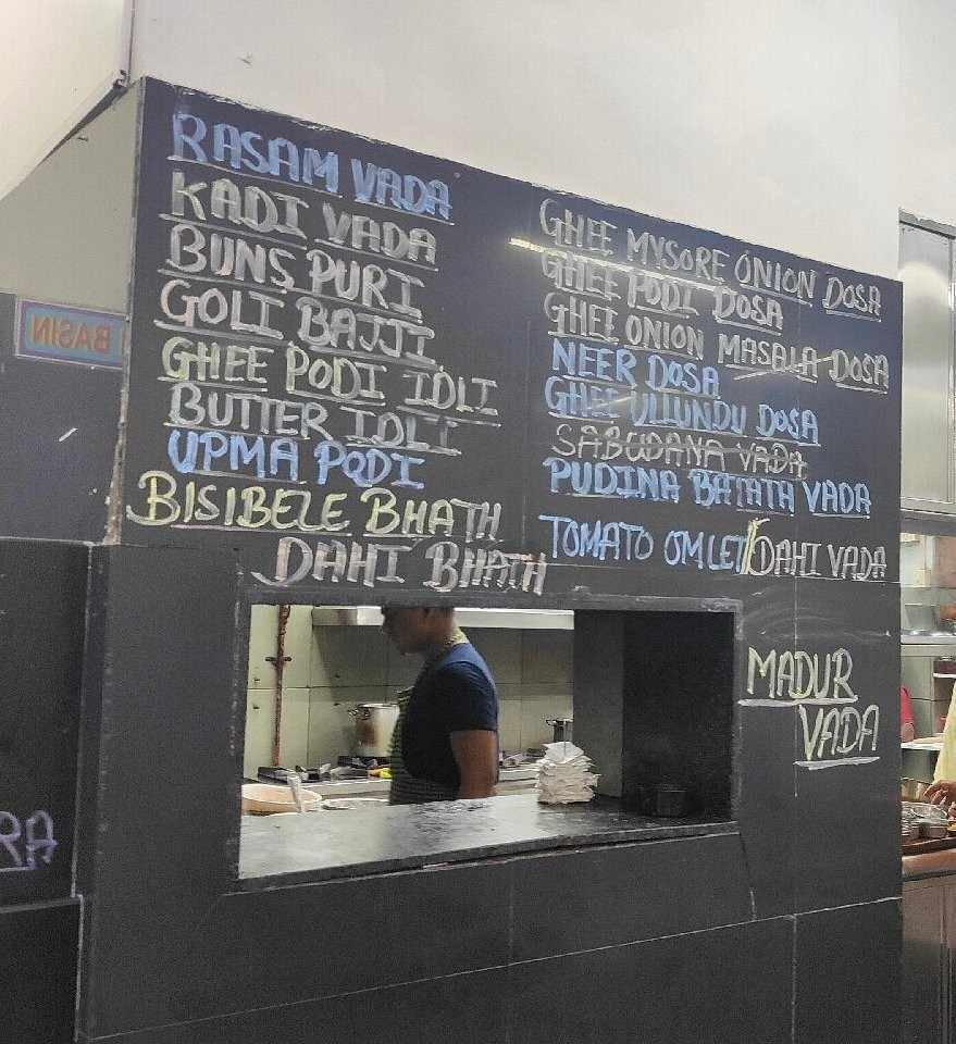 Ram Ashraya menu board displaying South Indian dishes like dosa idli and vada