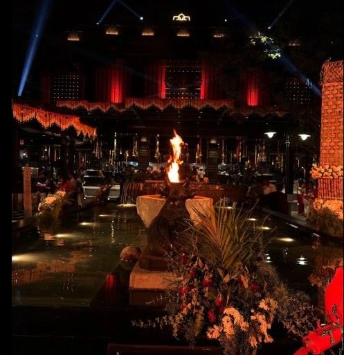 The Rameshwaram Cafe Bommasandra night view with traditional lighting and decorative fire setup