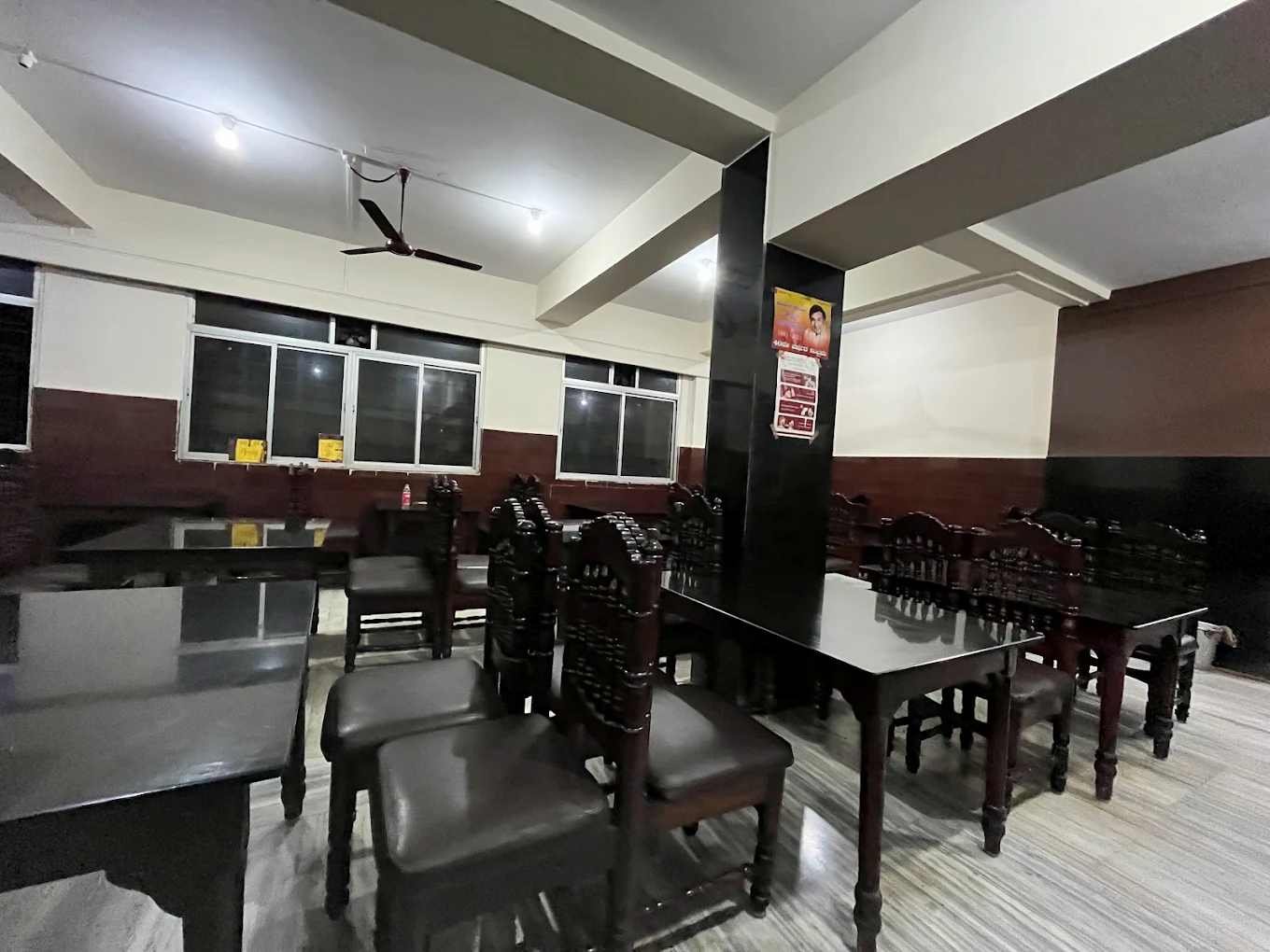 Inside seating and dining area of Hotel Navayuga Bangalore restaurant