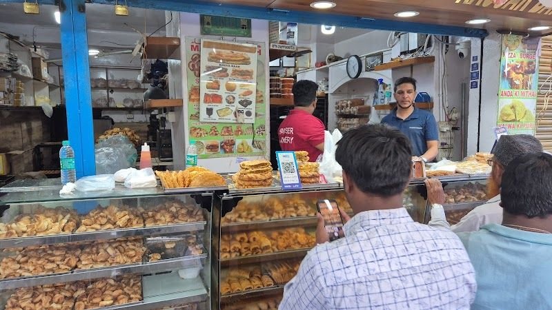 Crowded evening snack counter inside Kausar Bakery Bengaluru