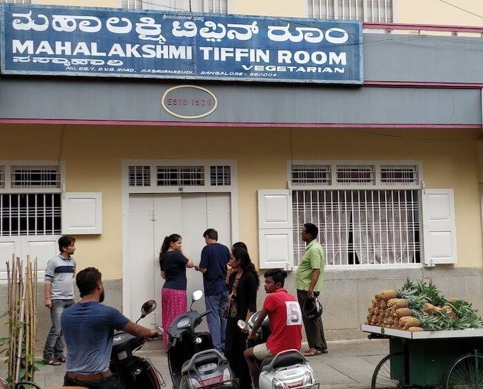 Maha Lakshmi Tiffin Room Basavanagudi entrance with signboard and customers waiting outside