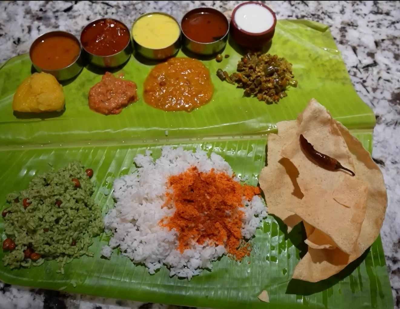 Traditional South Indian vegetarian meal served on banana leaf at House of Venu Krishna