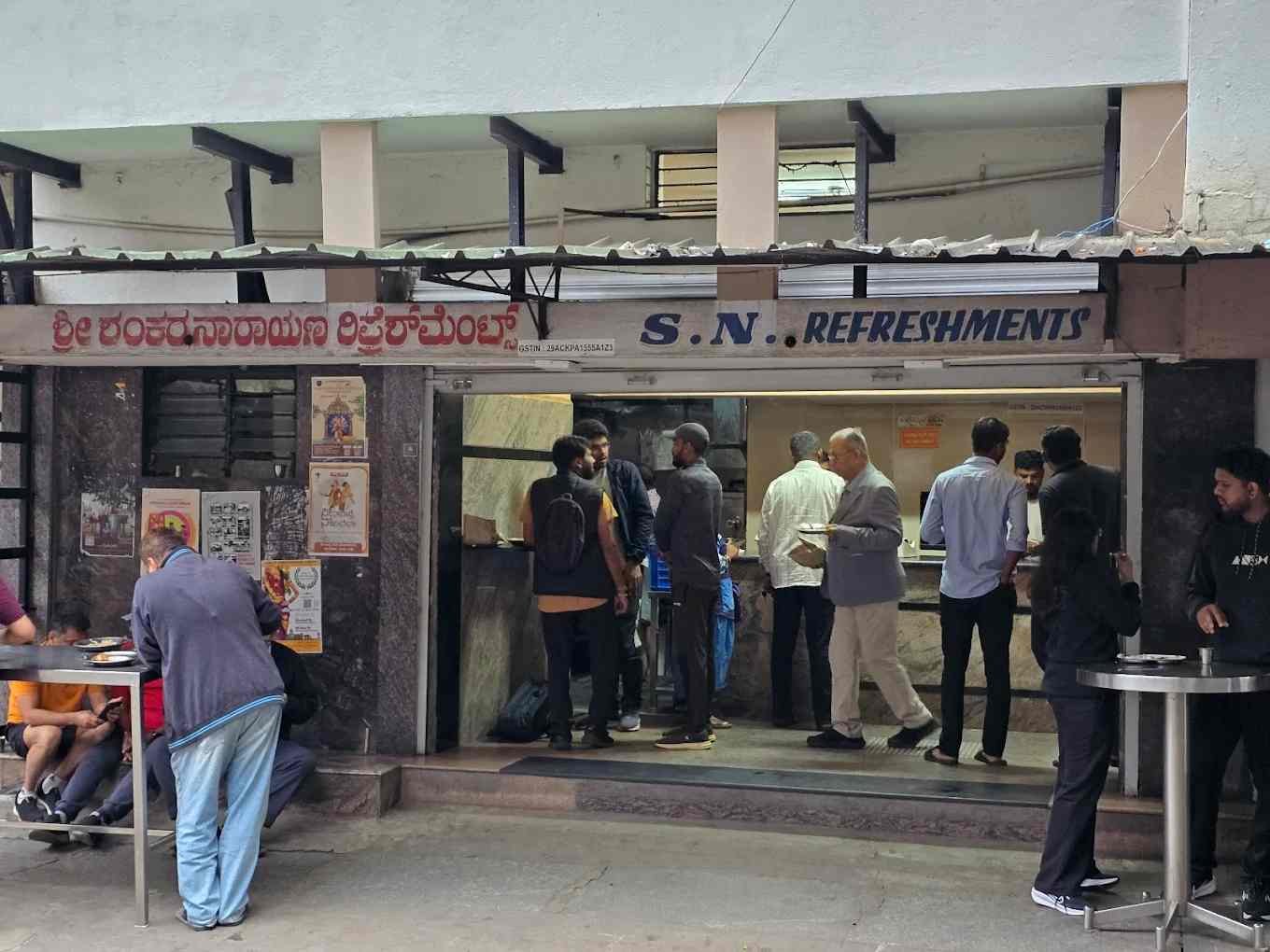 Customers enjoying breakfast outside S N Refreshments restaurant in JP Nagar Bengaluru.
