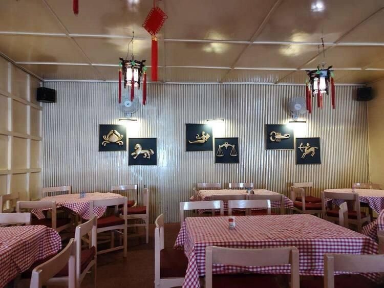 Vintage interiors of Shinkows Chinese Restaurant in Ooty with classic décor and checkered tables
