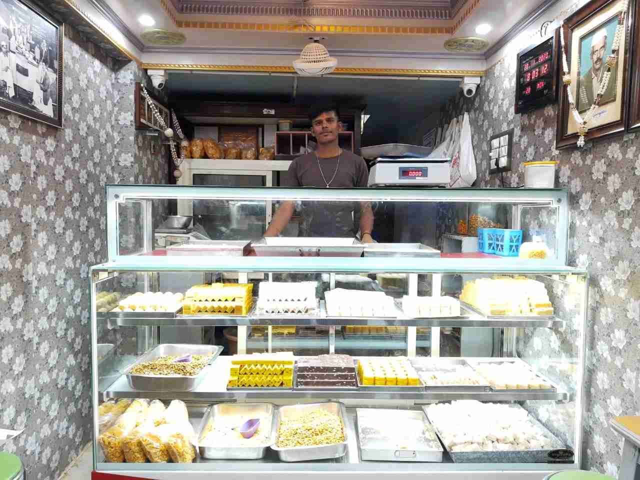 Inside Sri Chikkaveeranna Sweets Stall with traditional Karnataka sweets display