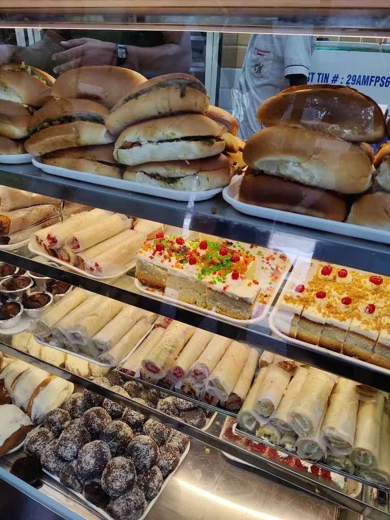 Fresh cakes, cream rolls, buns, and bakery snacks displayed inside Sri Jayalakshmi Bakery Bengaluru.