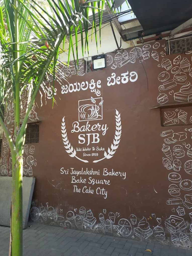 Sri Jayalakshmi Bakery wall art and branding in Bengaluru featuring bakery-themed illustrations.