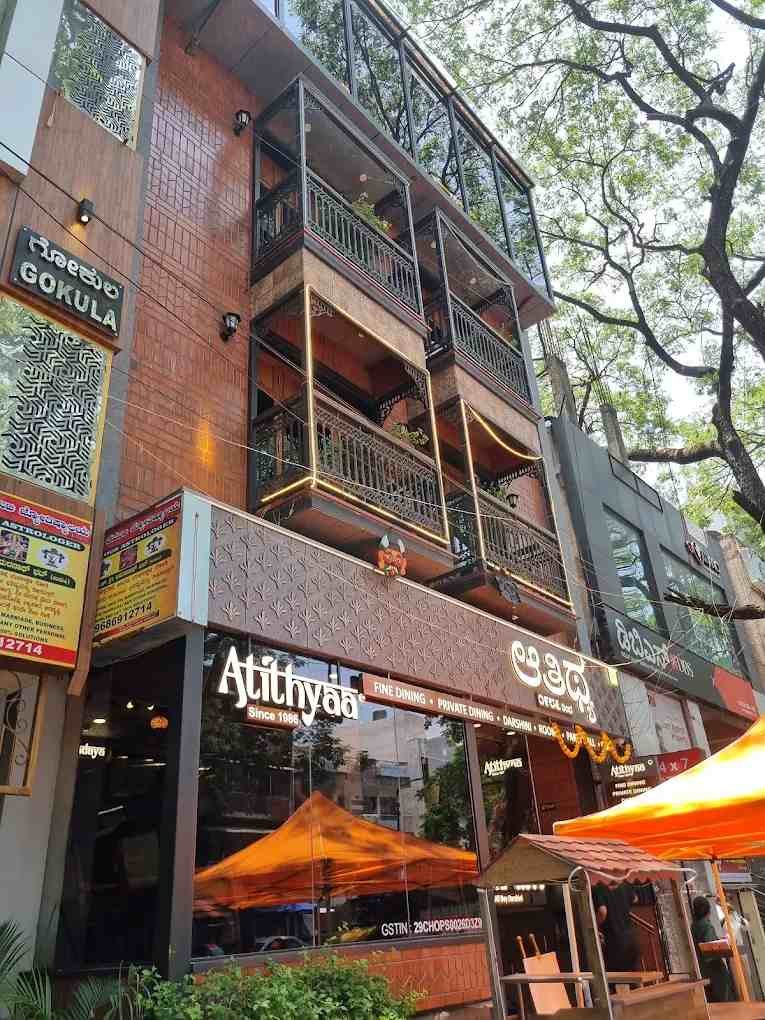 Atithyaa Since 1986 restaurant entrance in Gandhi Bazaar, Basavanagudi, Bengaluru, featuring its elegant multi-story façade and traditional South Indian dining atmosphere.