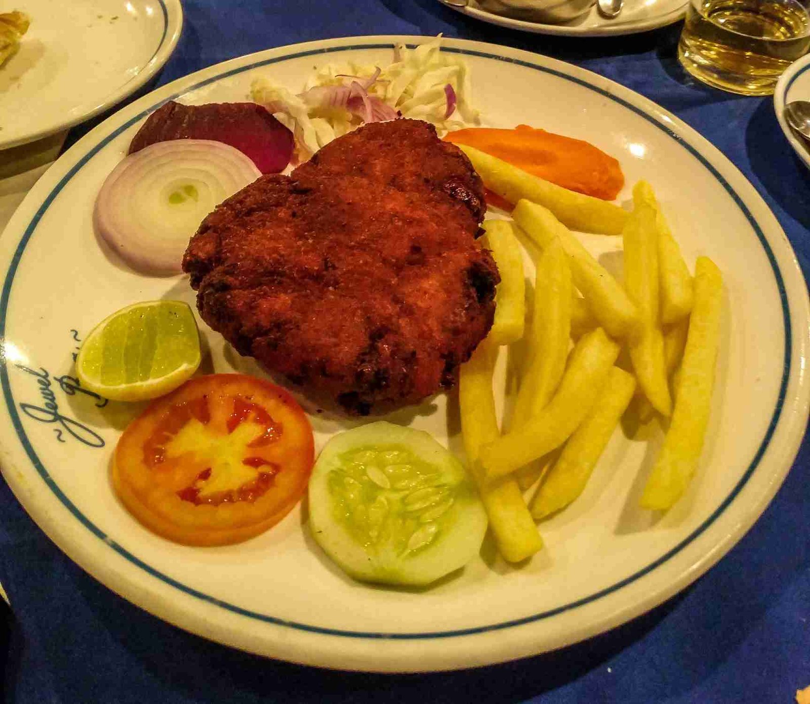 Famous mutton cutlet at Koshy's Bangalore with fries and fresh salad