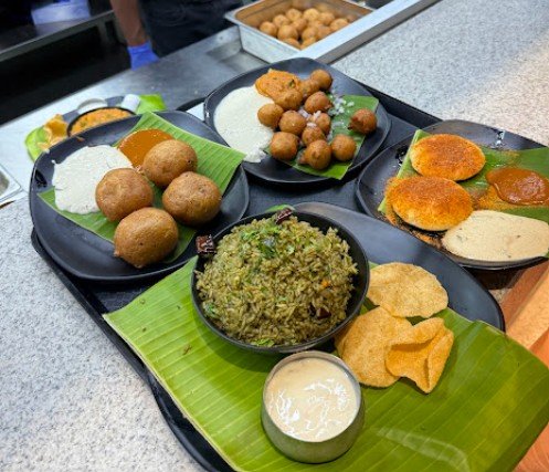 Traditional Andhra food platter at Babai Tiffins Bengaluru with Gongura Rice, Mysore Bonda, Punugulu, Andhra snacks, chutneys, and authentic tiffins.